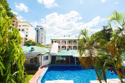 an image of a house with a swimming pool at Orchid Inn in Angeles