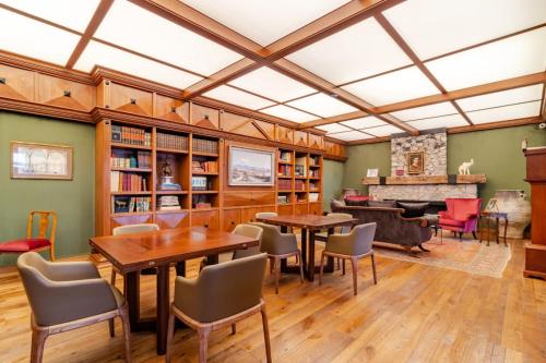 a dining room with wooden tables and chairs at Antiguo Molino de San Jerónimo in Mexico City