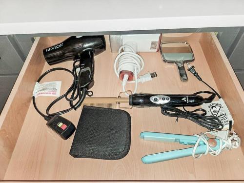 a table with a microscope and other items on it at BlissHaven Luxe & Spacious in Downtown Houston with Soaking Tub ,Rooftop and free Parking in Houston