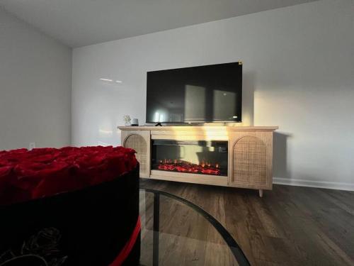 a living room with a fireplace with a tv above it at Home in Moor in Moore