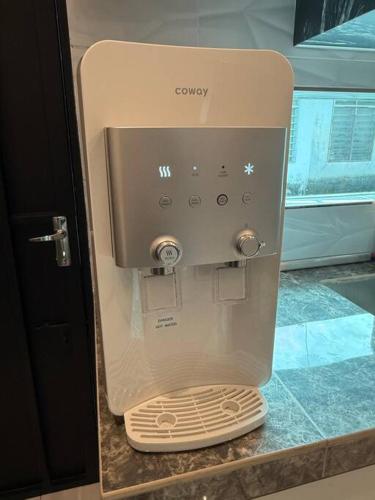 a coffee maker sitting on top of a counter at Live Like Your Home, Alma Bukit Mertajam in Bukit Mertajam