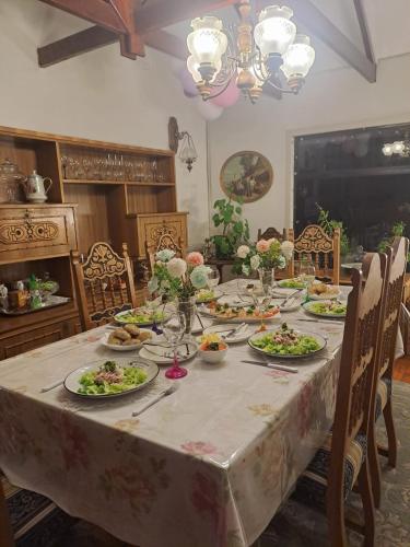 a dining table with plates of food on it at Tribal house in Río Seco