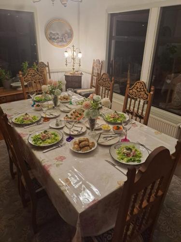 a dining table with plates of food on it at Tribal house in Río Seco