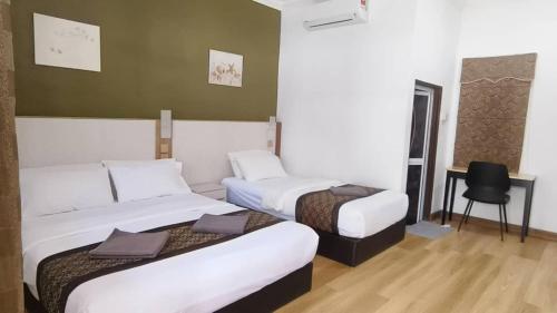 Ένα ή περισσότερα κρεβάτια σε δωμάτιο στο The Nutshell Chalet Langkawi