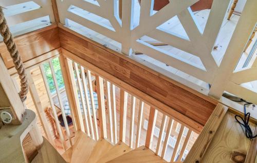 an overhead view of a wooden staircase in a house at 1 Bedroom Nice Apartment In Ljungbyhed in Ljungbyhed