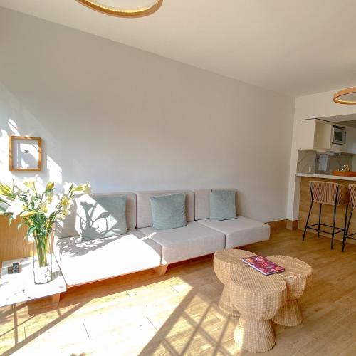 a living room with a couch and a table at Reforma Guest House in Mexico City