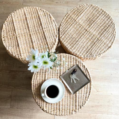 a table with a cup of coffee and a flower at Reforma Guest House in Mexico City