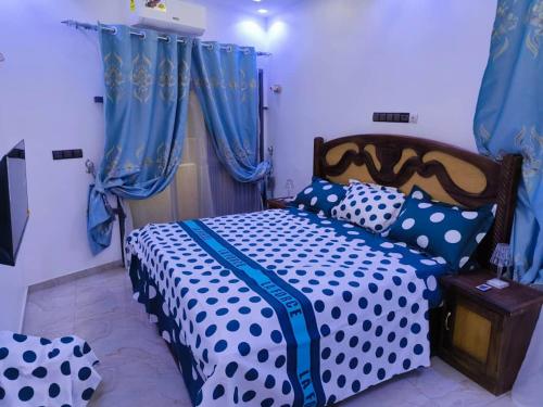 Postel nebo postele na pokoji v ubytování Britis Guest House in Lomé