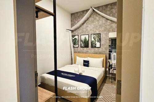 a hotel room with a bed and a desk at Forte Seasons Mossaz Premium Suites Petaling Jaya in Petaling Jaya