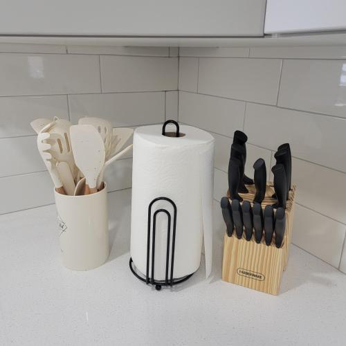 a counter with a knife block and a roll of paper towels at Cozy Cottage near USU in Logan