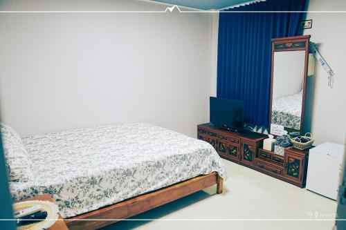 Ένα ή περισσότερα κρεβάτια σε δωμάτιο στο Gaho Guesthouse