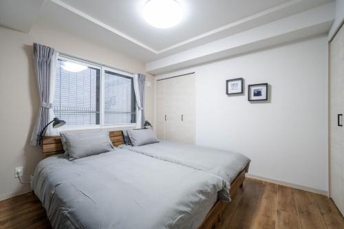Cama o camas de una habitación en Zabo Hills 201