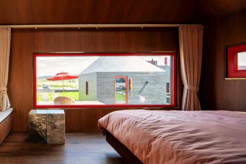 Una cama o camas en una habitación de 無热宇宙民宿