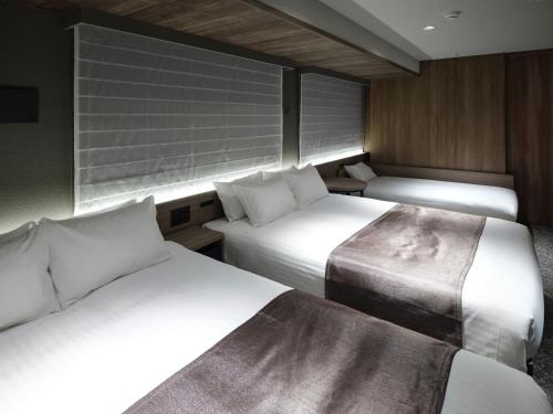 Katil atau katil-katil dalam bilik di MONday Apart Premium Kyoto Sta Kamogawa