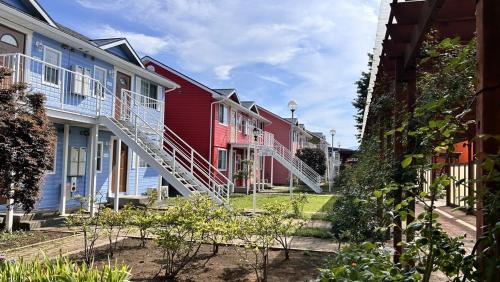 a row of colorful houses on a street at Gotemba Kogen Tokinosumika in Gotemba