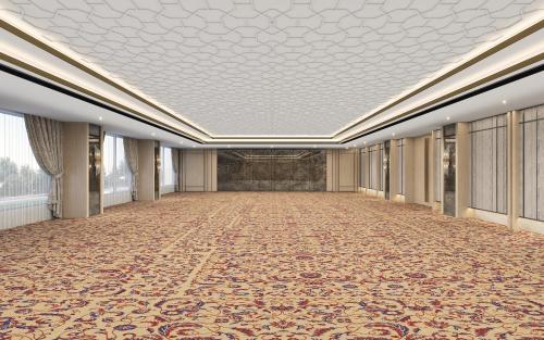 an empty hallway with a large room with a ceiling at Taj Cochin International Airport, Kerala in Cochin