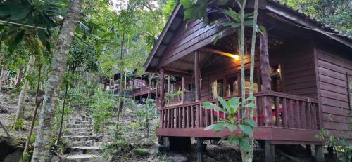 a wooden house in the middle of a forest at Sambath Sakseth Bungalow in Koh Rong Island