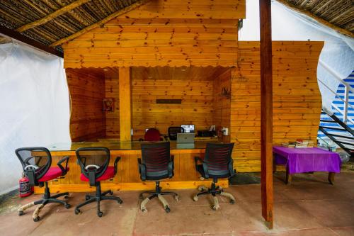 an office with a desk and chairs in a room at Om Sai Beach Resort in Agonda