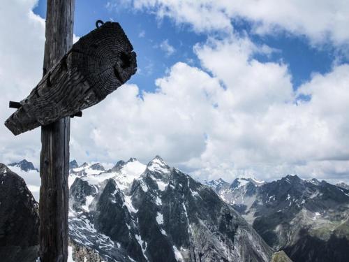 a wooden sign on top of a mountain at Chalet in Fulpmes near Stubai Glacier Skiing in Fulpmes