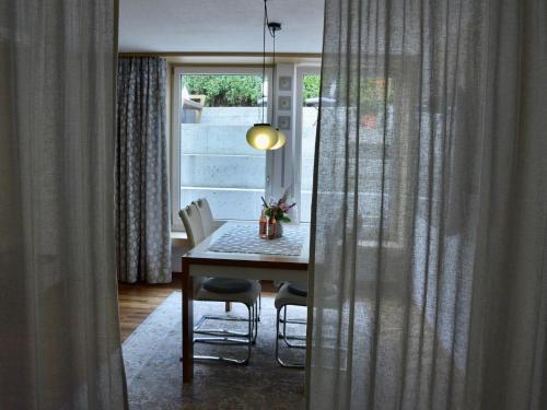 a dining room with a table and chairs and a window at Apartment in Fulpmes near Stubai Glacier in Fulpmes