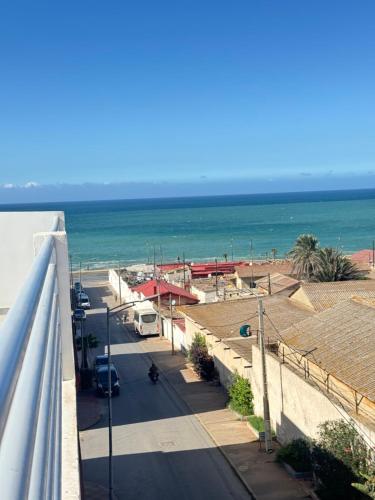 a view of the beach from a balcony at Ksar Labhar City Escape in Rabat