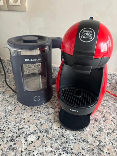 a black and red blender sitting on a counter at Ksar Labhar City Escape in Rabat