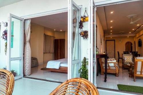 a room with a view of a bedroom at Sea La Vie Andaman in Haddo