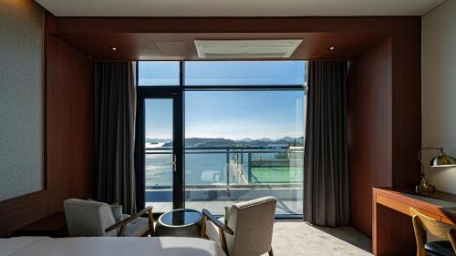 Krevet ili kreveti u jedinici u okviru objekta Hotel JCS Yeosu