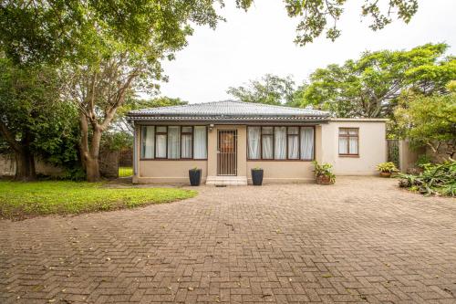 a house with a brick driveway in front of it at Family Retreat Holiday Home in Margate