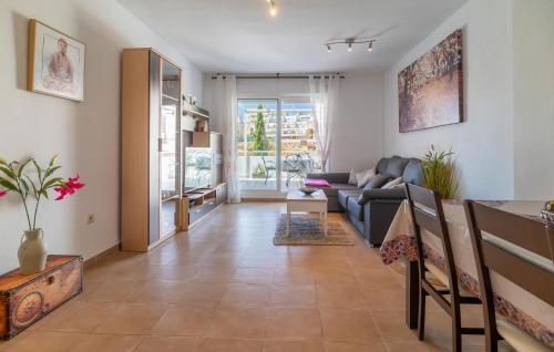 a living room with a couch and a table at Pet Friendly Apartment In Aguadulce in Aguadulce