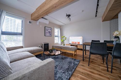 a living room with a couch and a table at Zabo Hills 305 in Sapporo