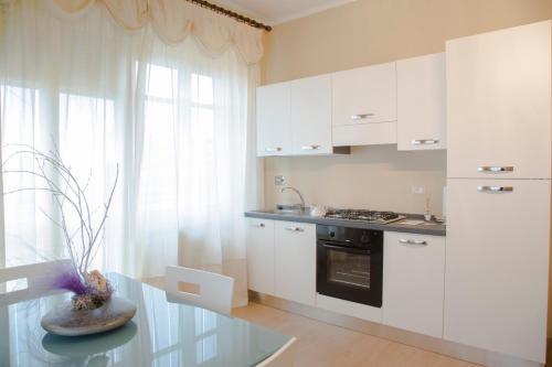 Kuchyň nebo kuchyňský kout v ubytování Hotel & Residence Corona Grossa Balangero
