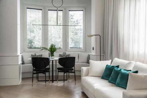 a living room with a white couch and a table at Casa Riva in Riccione