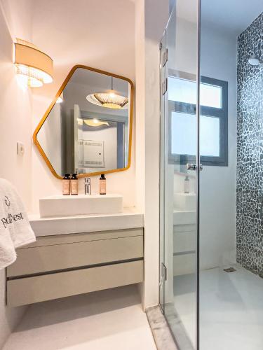 a bathroom with a sink and a mirror at El Gouna - BIRD NEST in Hurghada