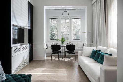 a living room with a white couch and a table at Casa Riva in Riccione