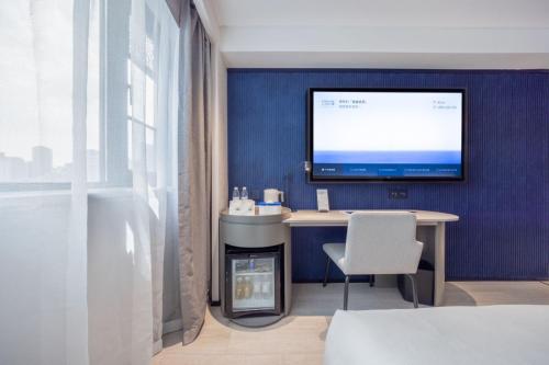 Ένα ή περισσότερα κρεβάτια σε δωμάτιο στο Atour Light Hotel Kunming Dongfeng Plaza Beijing Road