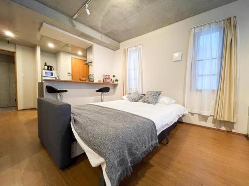 Postel nebo postele na pokoji v ubytování FL Residence Kagura Futei II