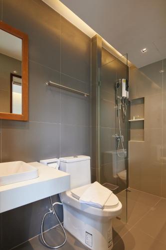 a bathroom with a toilet and a sink and a shower at ROOMS at Number60 Khaosan Bangkok in Bangkok