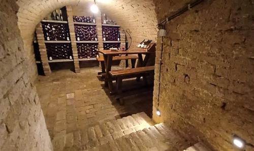 an overhead view of a wine cellar with a wooden table at Penzion u Dyje in Bulhary