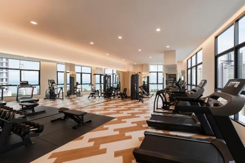 a gym with treadmills and exercise equipment in a building at Citadines Tanjung Tokong Penang in George Town