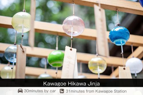 a bunch of glass ornaments hanging from a fence at SAUNA&HOTEL Suuh スゥ in Takahagi