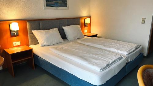 Postel nebo postele na pokoji v ubytování Hotel Siebeneichen