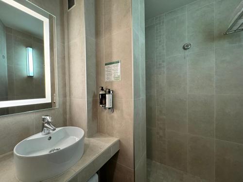 a bathroom with a sink and a shower at Boutique Hotel & Spa la Villa Cap Ferrat in Saint-Jean-Cap-Ferrat