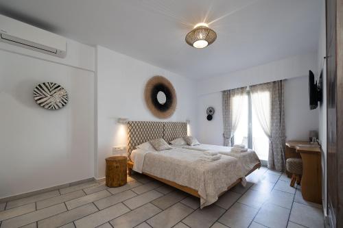En eller flere senge i et værelse på Hotel Villa Flora
