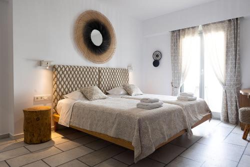 En eller flere senge i et værelse på Hotel Villa Flora