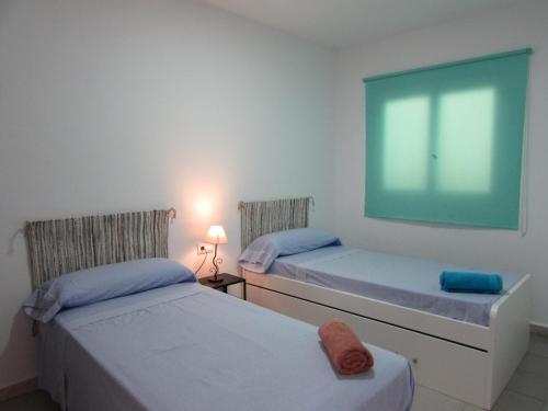 Posteľ alebo postele v izbe v ubytovaní MOJACAR HOME AND BEACH