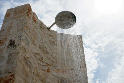 a tennis racket sitting on the side of a building at Quattroperle Trulli - Relax - Puglia in Castellana Grotte