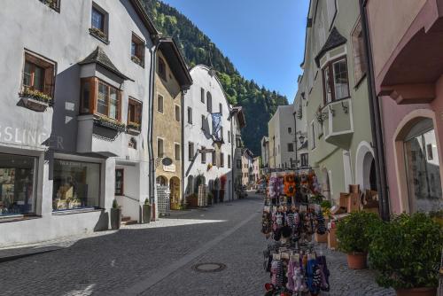 a street in a town with a bunch of stores at Penthouse Sonnenplatzl in Radfeld