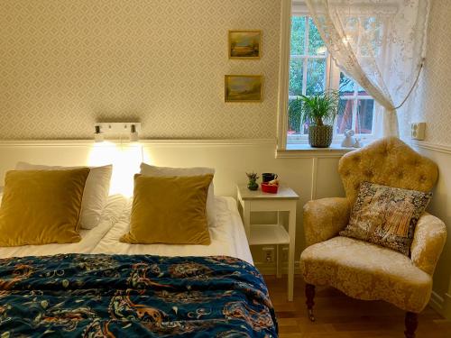 En eller flere senge i et værelse på Hotell St Clemens