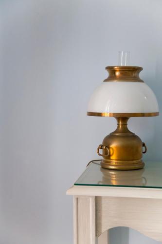 a lamp sitting on top of a table at Hotel Residence Mendolita in Lipari